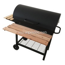 Barbecue me qymyr druri në kazan